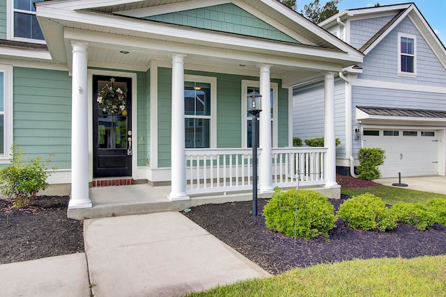 property entrance with covered porch and a garage