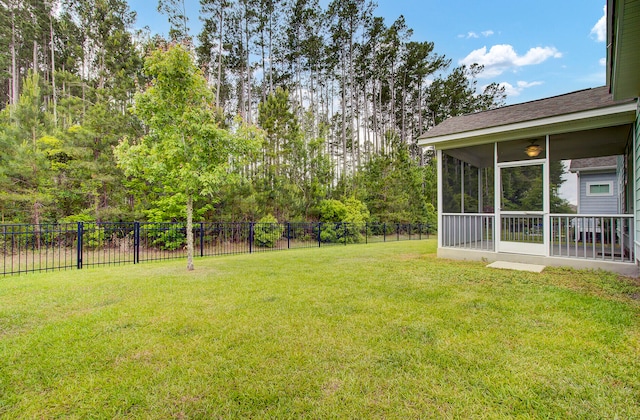 view of yard featuring a sunroom