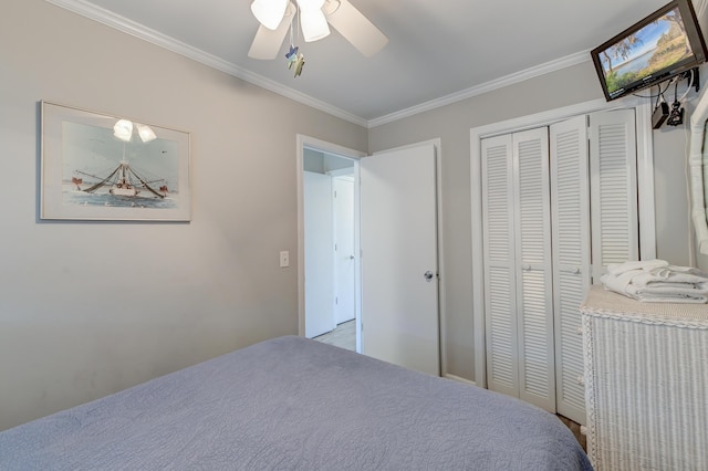 bedroom with a closet, ceiling fan, and ornamental molding