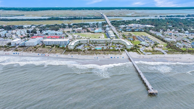 birds eye view of property with a beach view and a water view