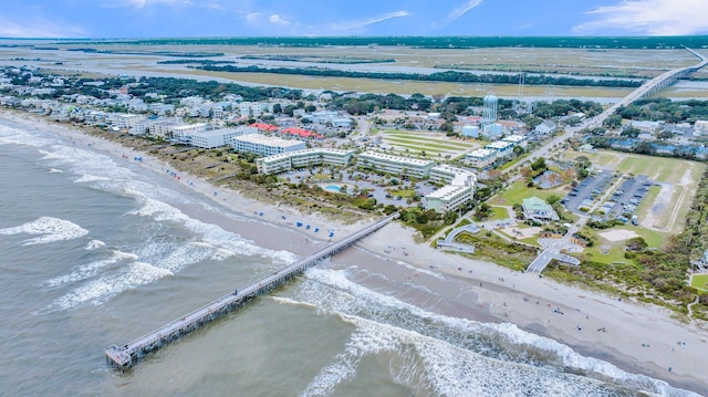 birds eye view of property featuring a water view and a view of the beach