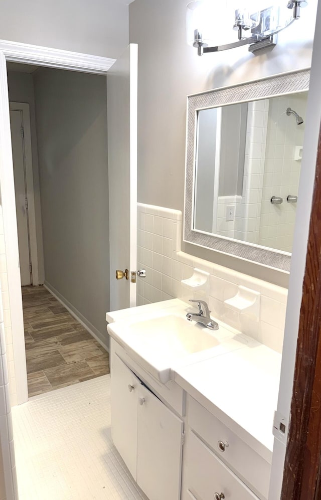 bathroom with vanity and baseboards