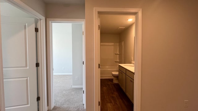 158 Yarrow Way, Moncks Corner, SC 29461 - hallway with baseboards, a sink, and dark colored carpet