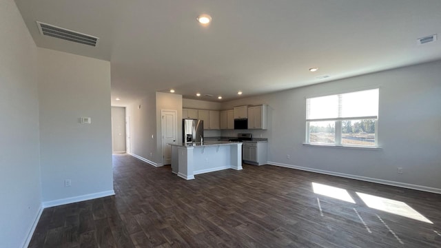 158 Yarrow Way, Moncks Corner, SC 29461 - kitchen featuring an island with sink, stainless steel fridge, open floor plan, visible vents, and dark wood-style flooring