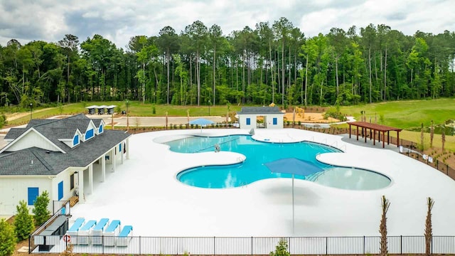 158 Yarrow Way, Moncks Corner, SC 29461 - community pool with fence, an outdoor structure, a patio area, and a view of trees