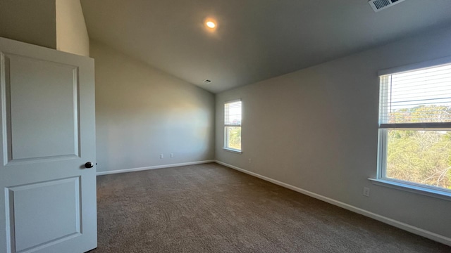 158 Yarrow Way, Moncks Corner, SC 29461 - empty room featuring baseboards, lofted ceiling, visible vents, and dark carpet