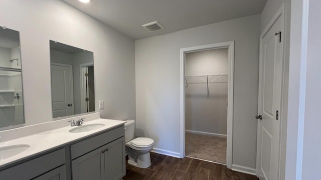 158 Yarrow Way, Moncks Corner, SC 29461 - bathroom with visible vents, double vanity, toilet, wood finished floors, and a sink
