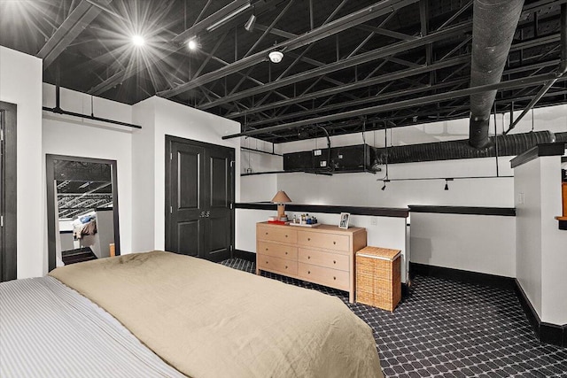 carpeted bedroom with baseboards