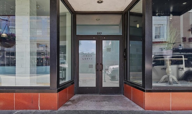 entrance to property featuring french doors