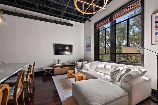 living area with a high ceiling and hardwood / wood-style floors