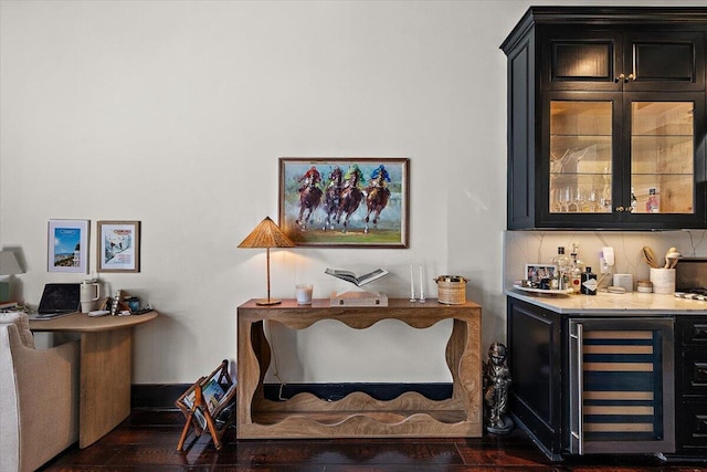 bar with a dry bar, wine cooler, and dark wood-style floors