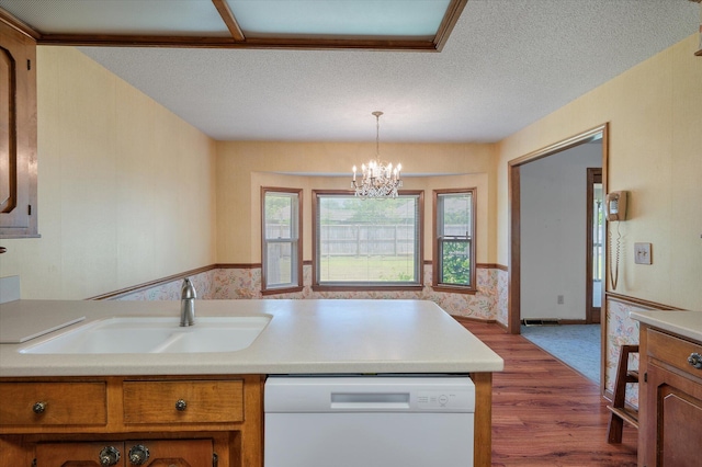 2912 Doncaster Dr, Charleston, SC 29414 - kitchen with white dishwasher, brown cabinets, a sink, wood finished floors, and light countertops