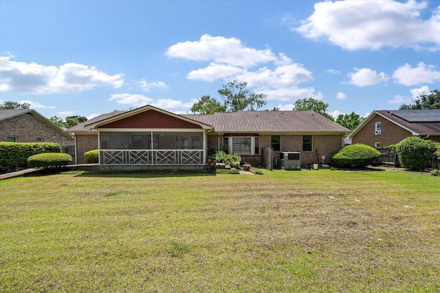 2912 Doncaster Dr, Charleston, SC 29414 - back of house featuring a sunroom, a yard, and brick siding