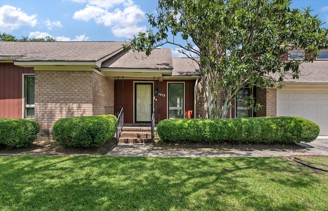 2912 Doncaster Dr, Charleston, SC 29414 - view of front of property featuring brick siding, a front lawn, and roof with shingles