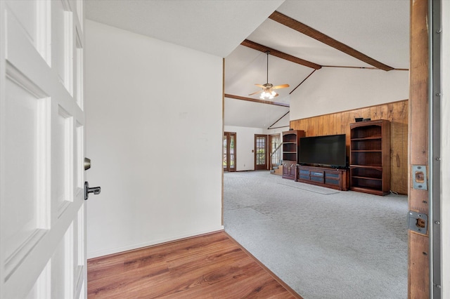 2912 Doncaster Dr, Charleston, SC 29414 - unfurnished living room featuring high vaulted ceiling, beamed ceiling, a ceiling fan, carpet flooring, and baseboards
