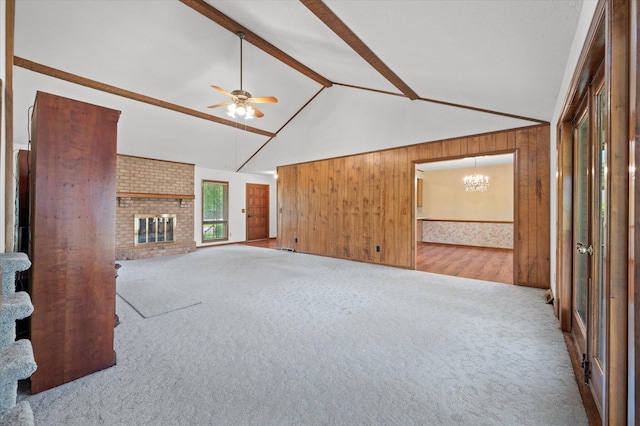 2912 Doncaster Dr, Charleston, SC 29414 - unfurnished living room featuring carpet flooring, a chandelier, ceiling fan, beamed ceiling, and wooden walls