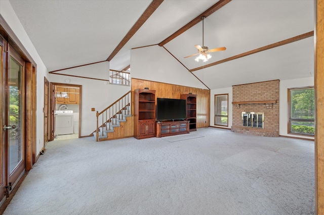 2912 Doncaster Dr, Charleston, SC 29414 - unfurnished living room with washer / dryer, light carpet, beamed ceiling, ceiling fan, and stairs