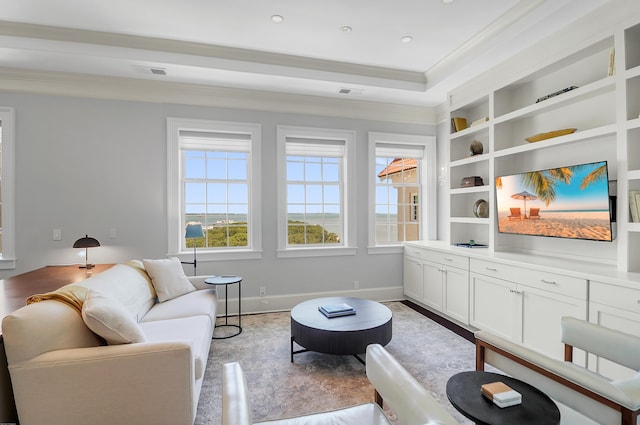 1 King Unit 702, Charleston, SC 29401 - living room featuring crown molding, built in features, and light wood-type flooring