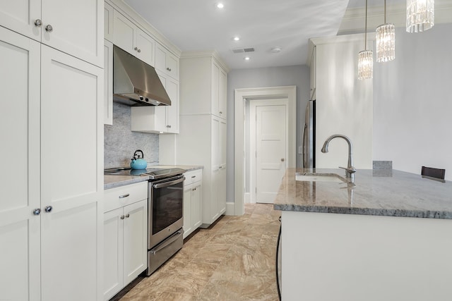 1 King Unit 702, Charleston, SC 29401 - kitchen with appliances with stainless steel finishes, under cabinet range hood, recessed lighting, decorative backsplash, and light stone countertops
