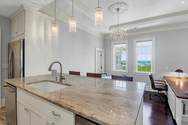 1 King Unit 702, Charleston, SC 29401 - kitchen with dark wood finished floors, crown molding, a desk, a tray ceiling, and decorative light fixtures