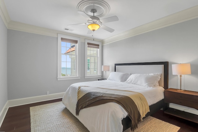 1 King Unit 702, Charleston, SC 29401 - bedroom with ornamental molding, wood finished floors, and a ceiling fan