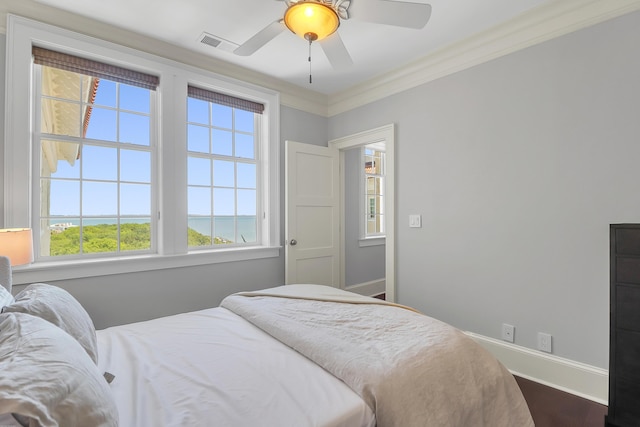 1 King Unit 702, Charleston, SC 29401 - bedroom with multiple windows, ornamental molding, ceiling fan, and dark wood-type flooring