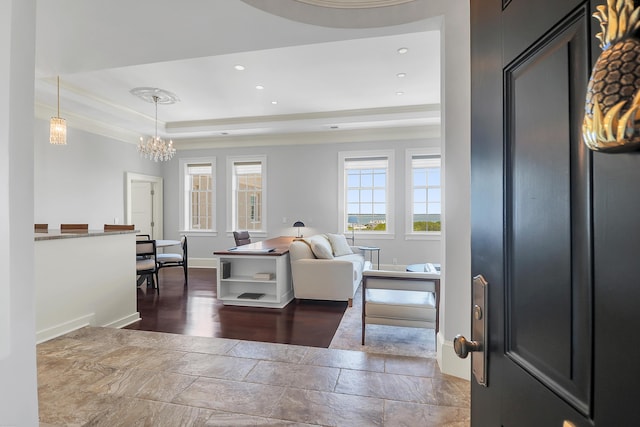 1 King Unit 702, Charleston, SC 29401 - foyer entrance with a raised ceiling, a chandelier, stone tile flooring, recessed lighting, and ornamental molding