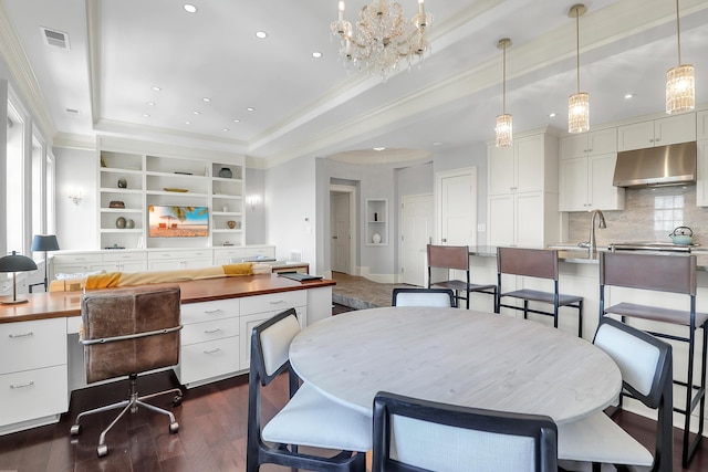 1 King Unit 702, Charleston, SC 29401 - dining room featuring recessed lighting, a tray ceiling, crown molding, dark wood-style flooring, and built in shelves