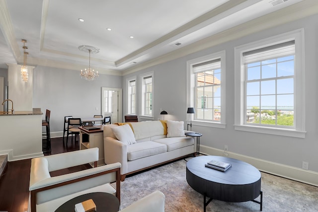 1 King Unit 702, Charleston, SC 29401 - living area featuring healthy amount of natural light, a tray ceiling, a chandelier, recessed lighting, and crown molding