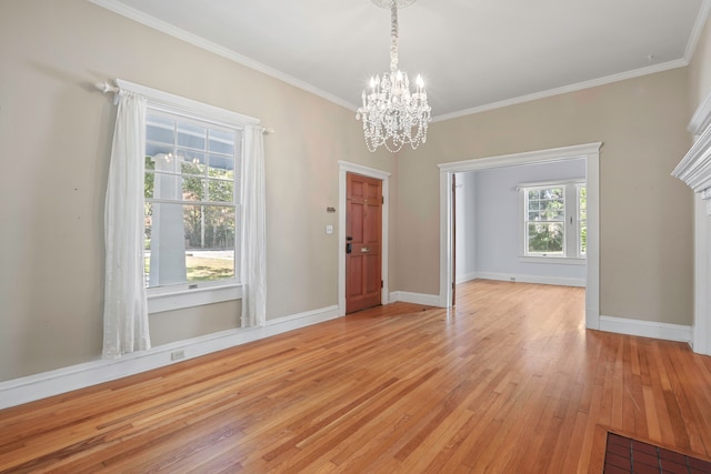 unfurnished dining area with crown molding, a healthy amount of sunlight, and light hardwood / wood-style flooring