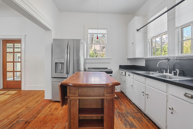 kitchen featuring sink, stainless steel fridge with ice dispenser, white cabinets, and dark hardwood / wood-style flooring