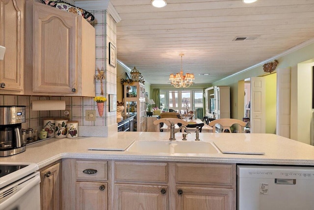 kitchen featuring an inviting chandelier, light brown cabinets, white dishwasher, and sink