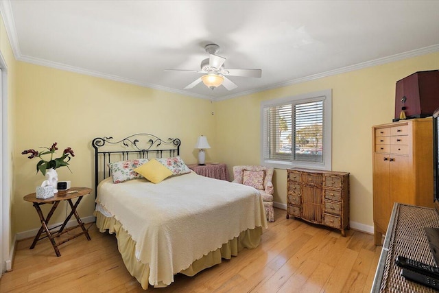 bedroom with light hardwood / wood-style floors, ceiling fan, and crown molding