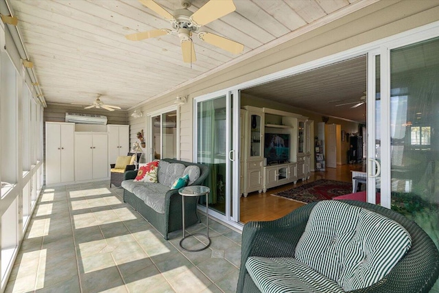 sunroom with ceiling fan, wood ceiling, and a wall unit AC