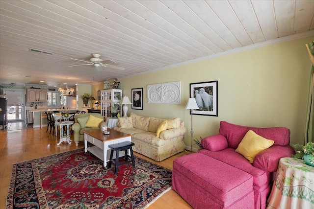 living room with wood ceiling, crown molding, ceiling fan with notable chandelier, and light wood-type flooring