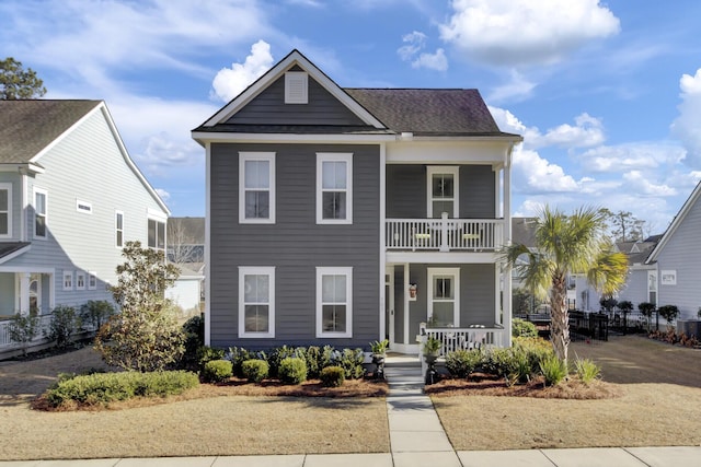 view of front facade with a porch and a balcony