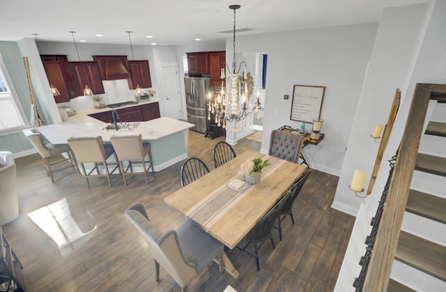 dining area featuring dark hardwood / wood-style flooring and sink