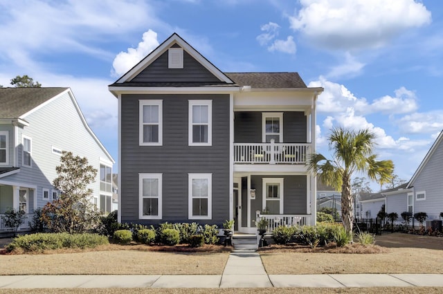 view of front of property featuring a balcony