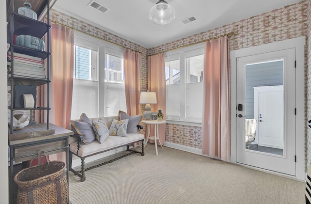 sitting room featuring carpet flooring