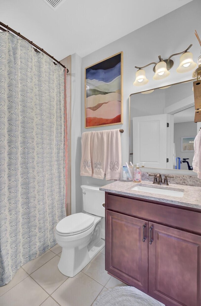 bathroom featuring vanity, tile patterned flooring, toilet, and a shower with curtain