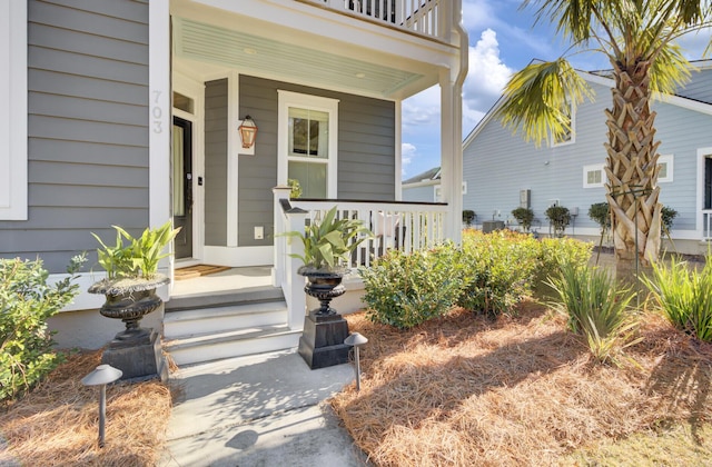 view of exterior entry with a porch