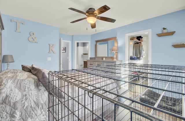 bedroom with ceiling fan, a closet, and a walk in closet