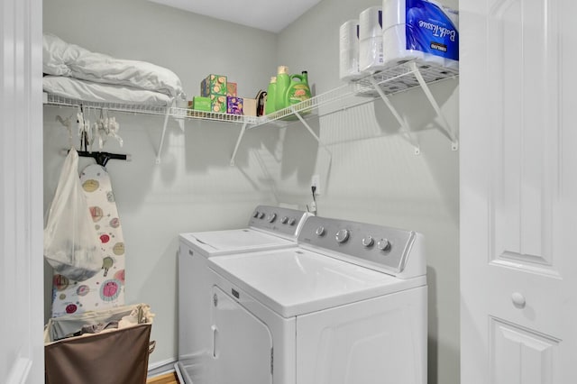 laundry area featuring washing machine and clothes dryer