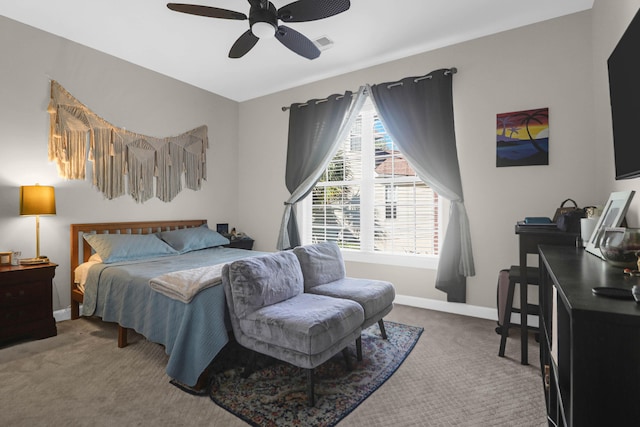 bedroom featuring carpet, baseboards, and a ceiling fan