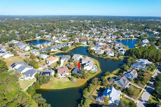 aerial view of property and surrounding area with nearby suburban area and a nearby body of water