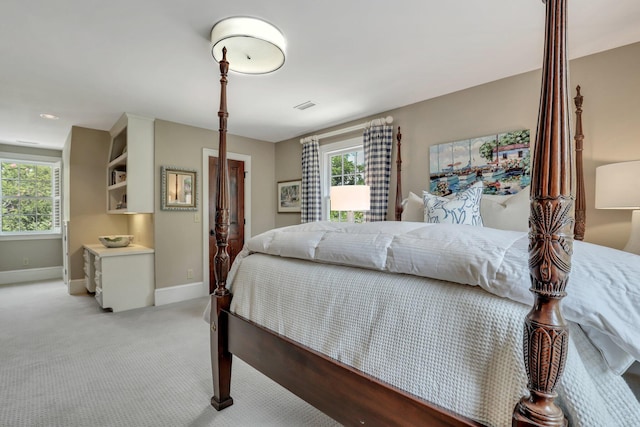 bedroom with light carpet