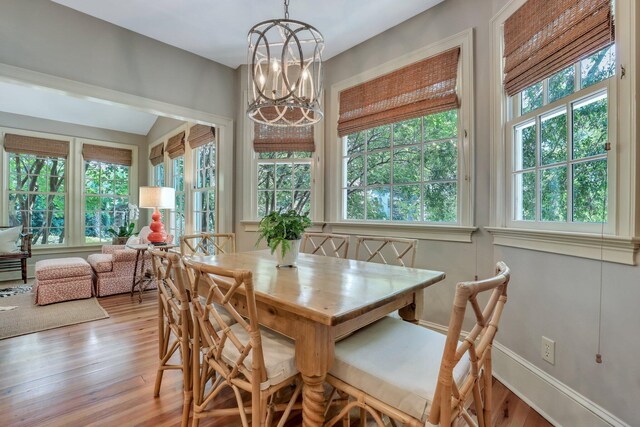 kitchen with white cabinetry, tasteful backsplash, light wood-type flooring, sink, and dishwasher