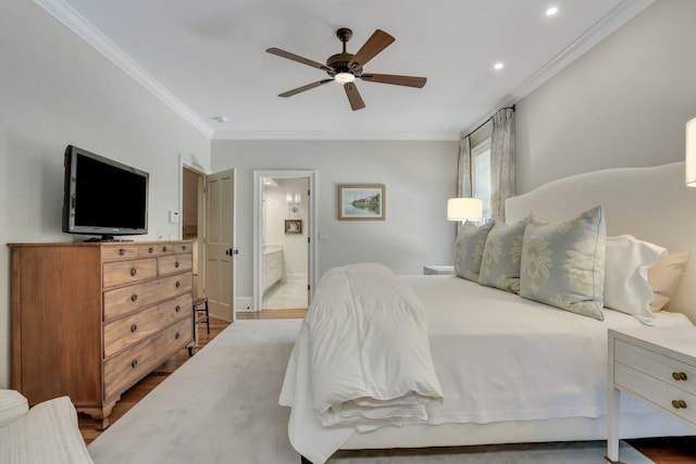 bedroom featuring wood-type flooring, connected bathroom, crown molding, and ceiling fan