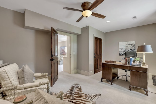 office space featuring light colored carpet and ceiling fan