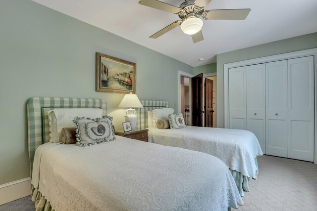 office space featuring light colored carpet and ceiling fan